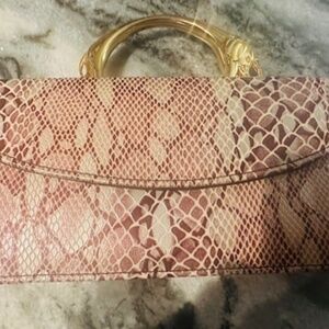 Elephant Gold Handle Burgundy Leather Clutch Bag